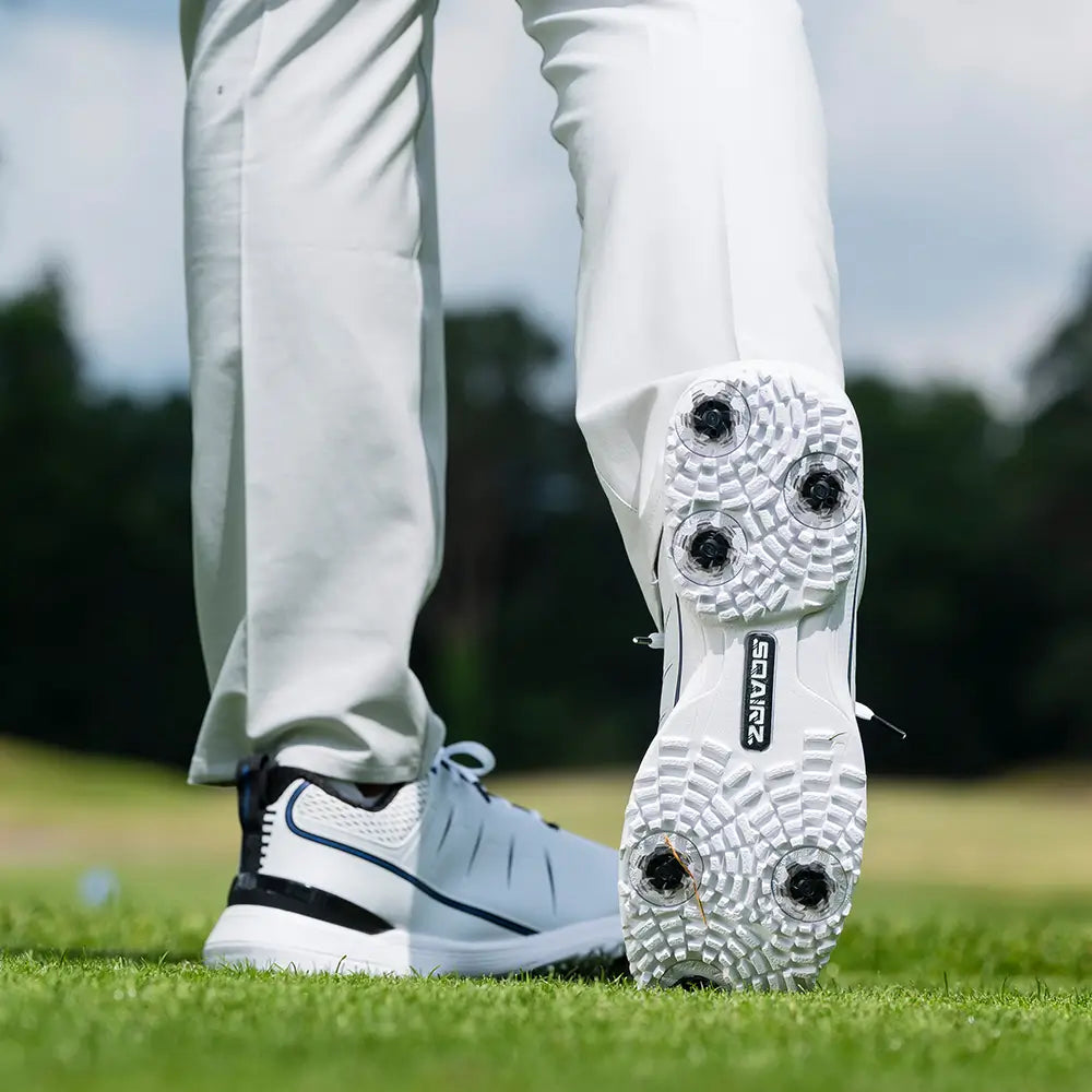 The bottom of a golfers shoe showing the attached Pivix Golf Spikes to the shoe.