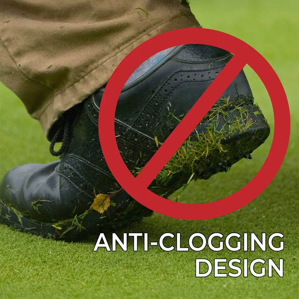 A shoe with grass all over it and a block sign over it showing the anti-clogging design.