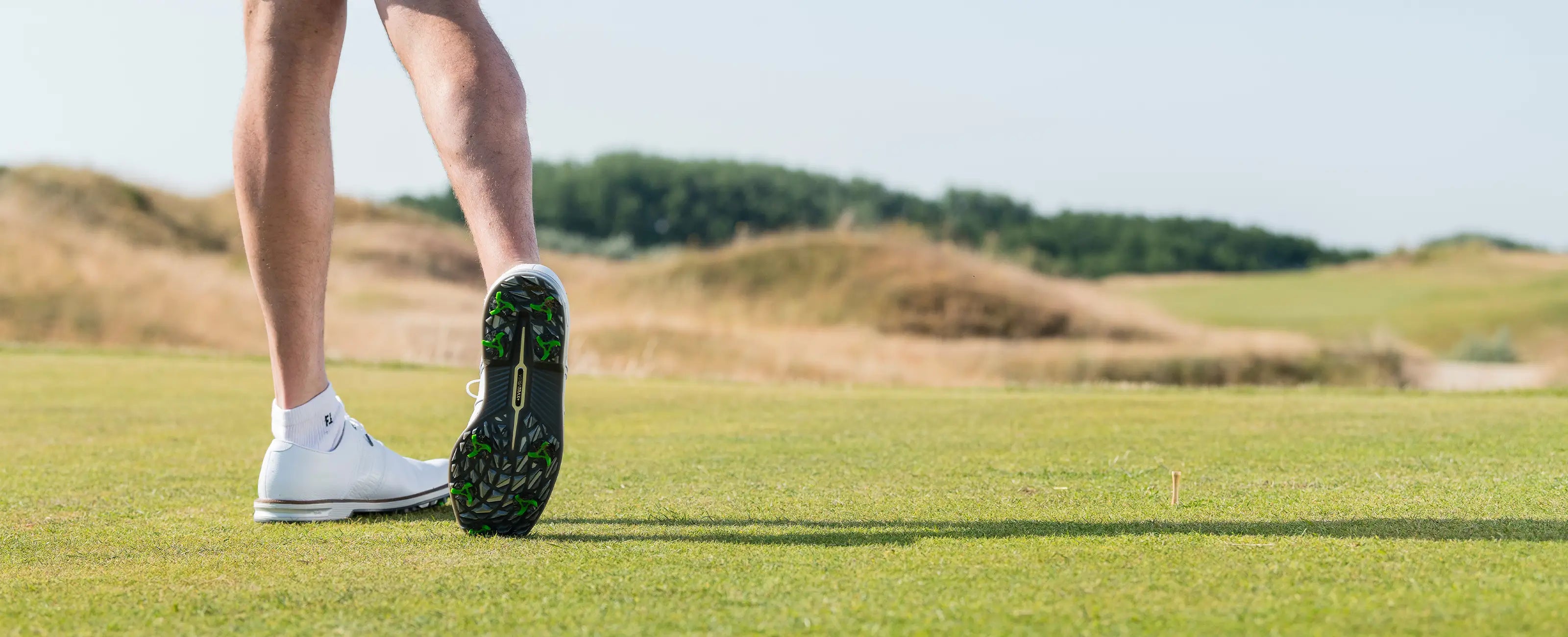 The underside of a golfers shoe showing the Tour Flex Pro Spikes on attached to the golf shoe. 
